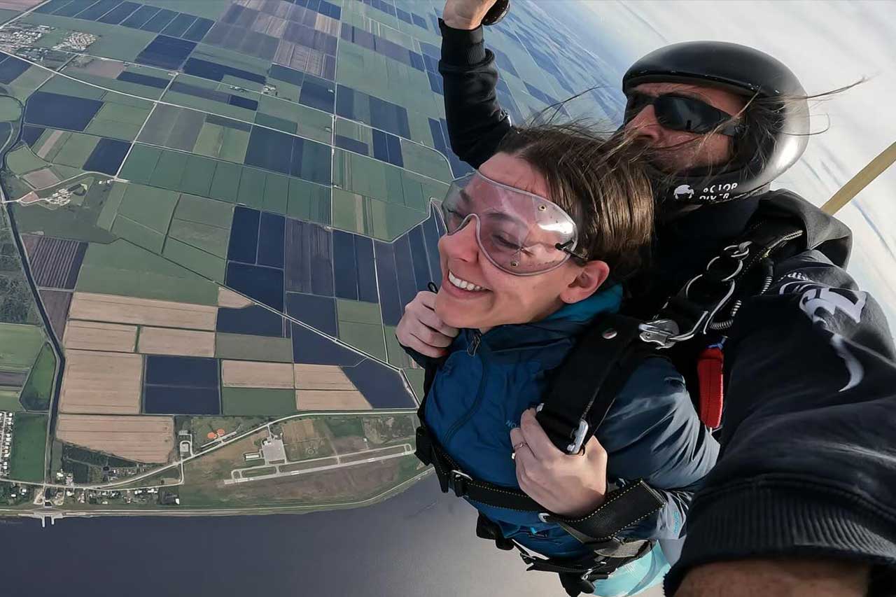 woman and tandem instructor in skydiving freefall over florida