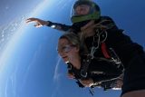 smiling female tandem student in freefall