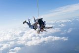 Tandem skydiving instructor and student in freefall above Lake Okeechobee in Florida