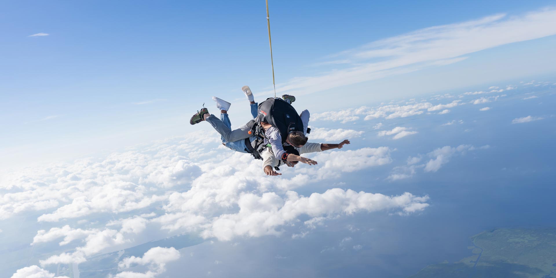 Tandem skydiving instructor and student in freefall above Lake Okeechobee in Florida